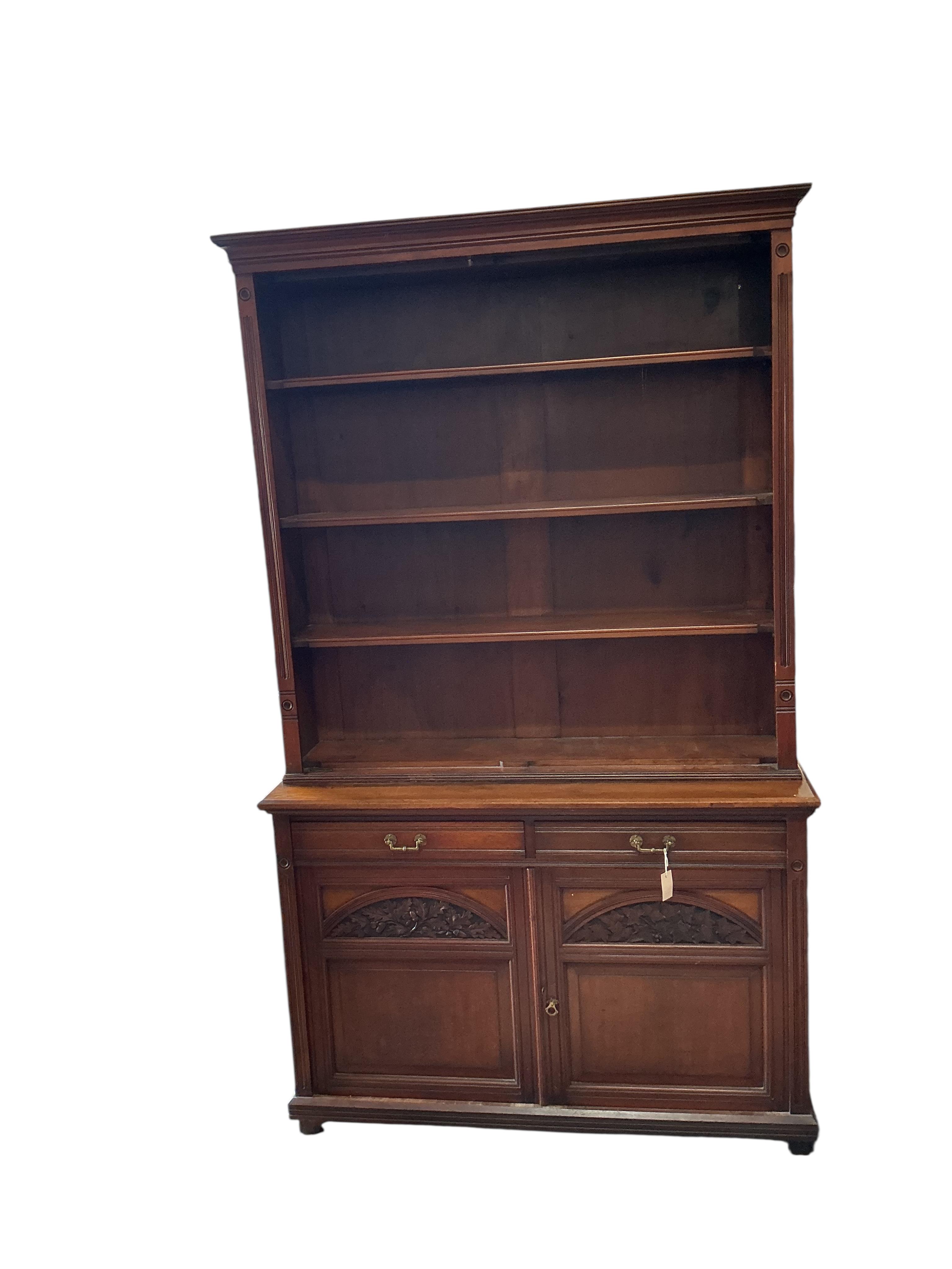 A late Victorian oak library bookcase, lacking doors, width 138cm, depth 44cm, height 230cm